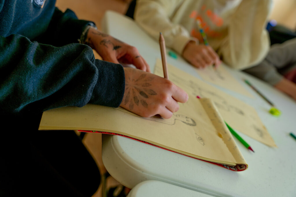 Drawing and painting during an art event near Kramatorsk, Ukraine. The war has been going on for more than a year, and there are still many children living in the embattled areas. © Madison Tuff