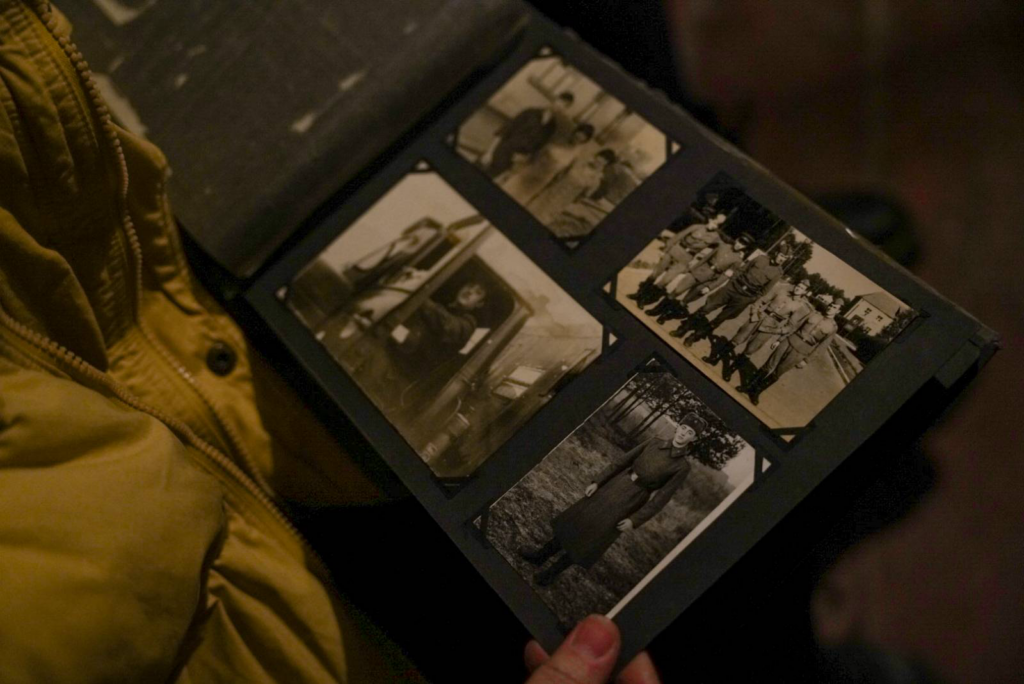 Eugenii shows us a photo album from his time in military service in the GDR. © Madison Tuff